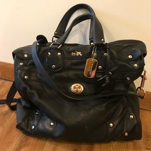 Coach Rhyder 33 in black and gold